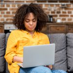 Woman at Home Using Laptop