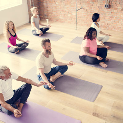 yoga class practicing meditation